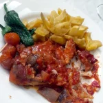 Ventresca de bacalao con fritada, tomates, y caracoles